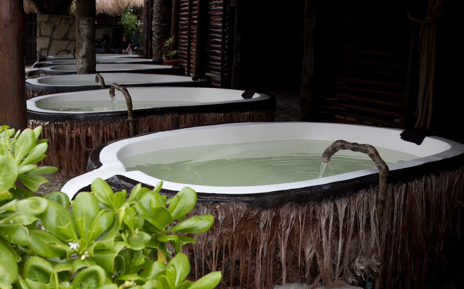 A row of hot tubs sitting next to each other